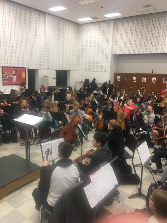 Orchestra students warming up at Canton High School. 
