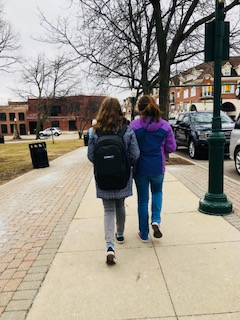 Lucy Schneider and Lydia Cahill walking in Downtown Plymouth. 