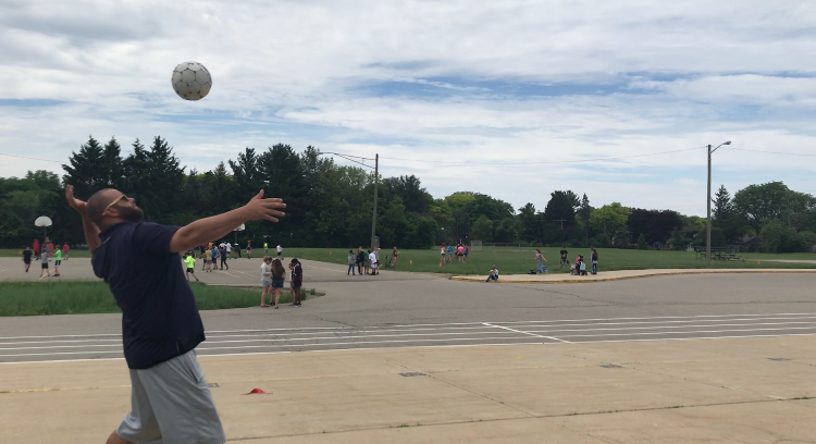 Mr. Wells about to spike the volleyball. 
