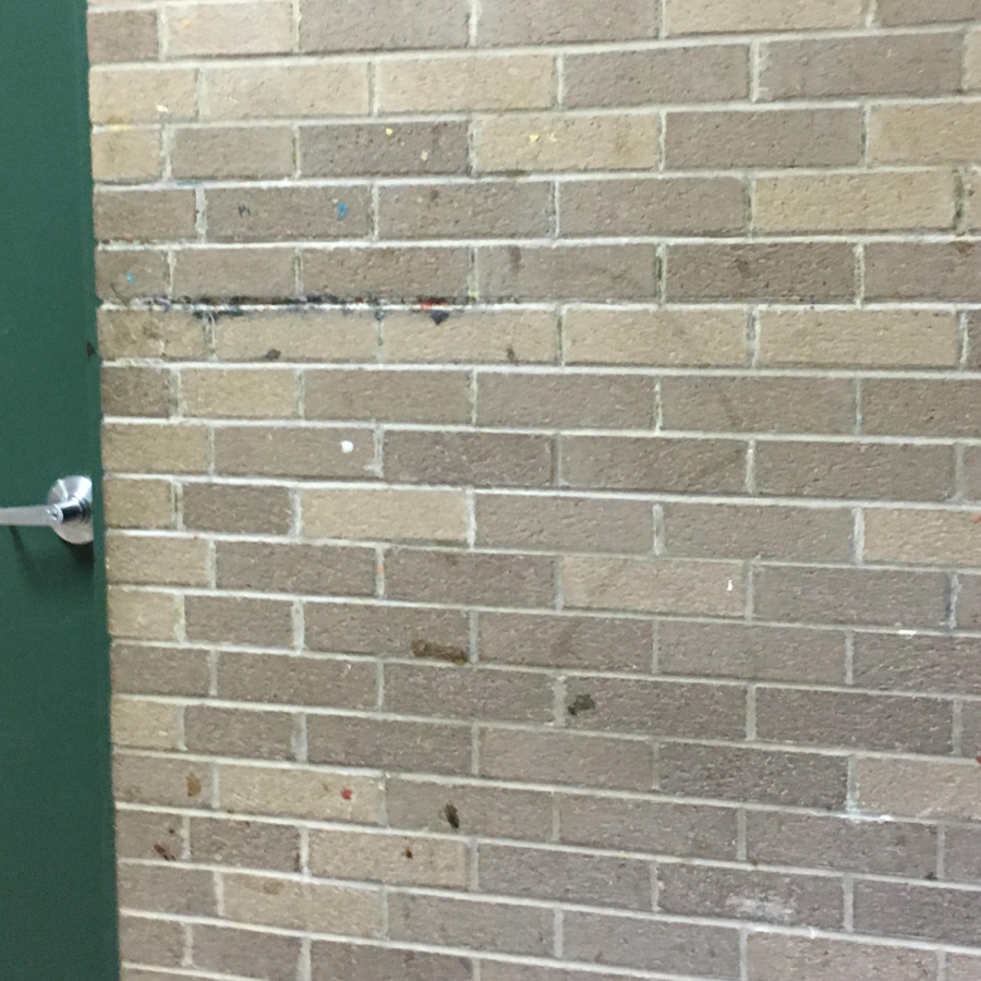 A wall covered in gum by the West cafeteria. 
