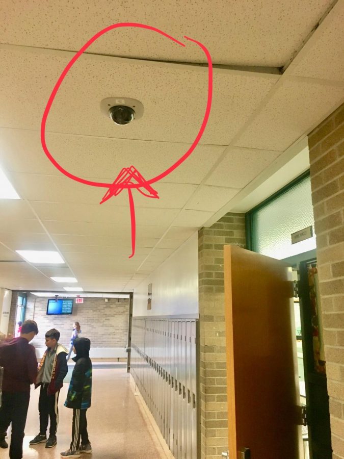 Security camera in C Wing outside of Mrs. Bazzi's classroom door. 