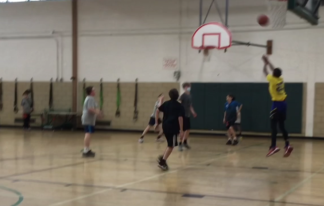 WMS+student+shoots+a+three-pointer+during+PE.+