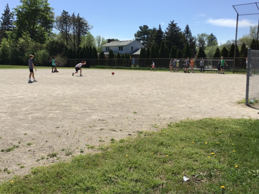 7th graders playing kickball in Mr. Almachy's gym class