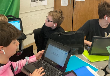 Students wear airpods in class. 