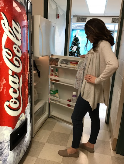 Mrs.Horvath looks for food in the staff lounge fridge.