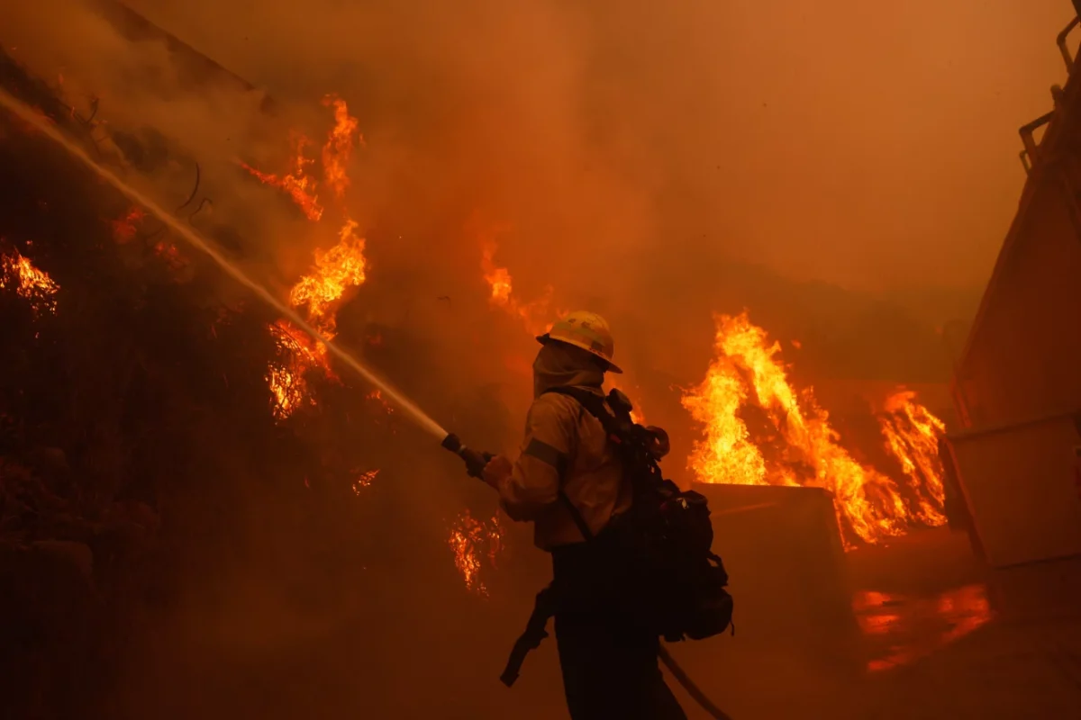 Tuesday, Jan. 7: A firefighter battles the advancing Palisades Fire in the Pacific Palisades neighborhood of Los Angeles.